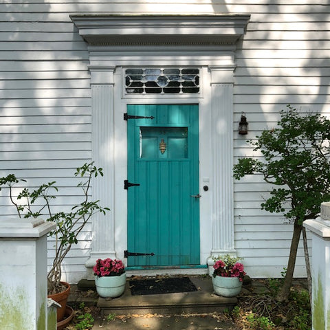 bright turquoise door in the borough