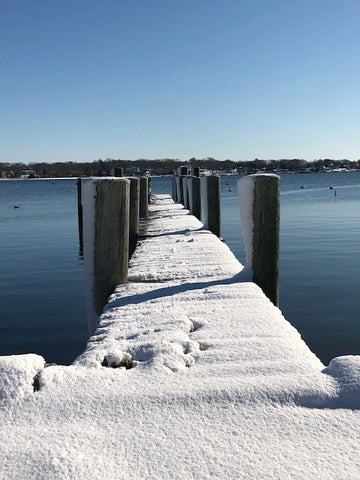 a snowy dock on the Mystic River