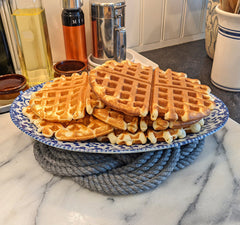 gray trivet and plate of waffles