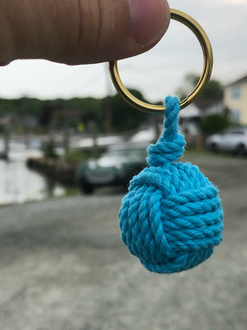 monkey fist keychain with Austin Healy Sprite along the Mystic River