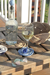 tan woven bowl, coasters and trivets