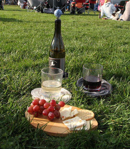 cheese board, trivets and wine picnic scene