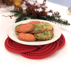 large red trivet with plate of cookies
