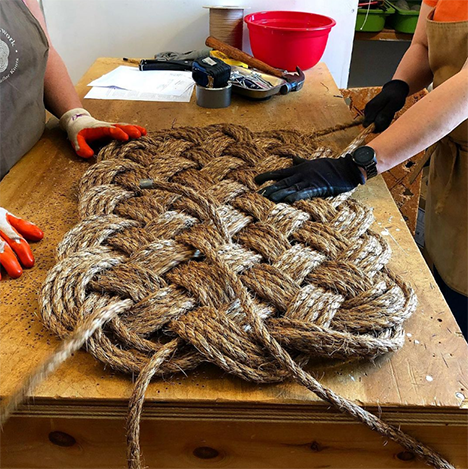 Mystic Knotwork artisans making a manila door mat