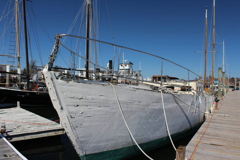 An old wooden boat at Schooners Wharf in Mystic