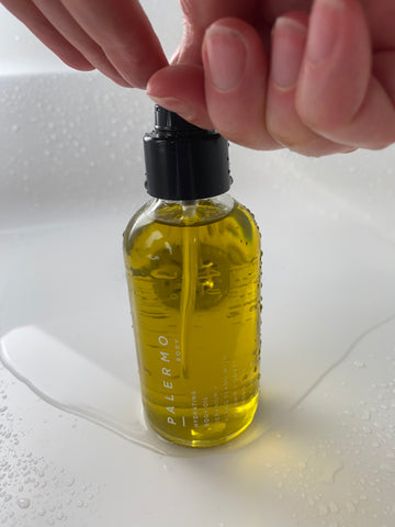 hand with body oil