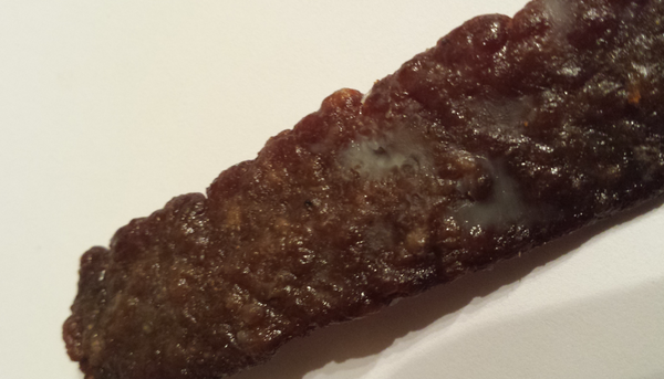 Normal Fat Deposit on a piece of Simple Primitive Beef Jerky for Dogs made by My Human "N" Me