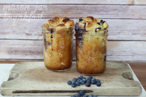 Two mason jars with blueberry french toast baked inside.