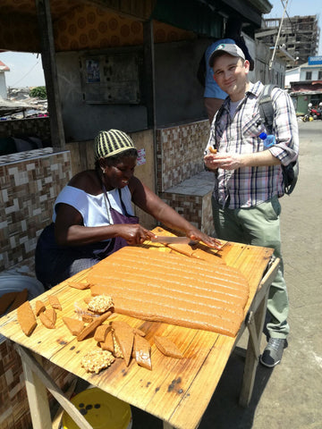An artisan preparing Nkate, ​a ​delicious ​​peanut brittle