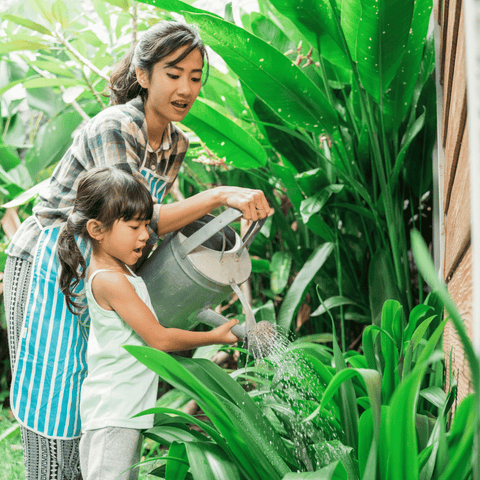 Mom and Daughter Gardening Together