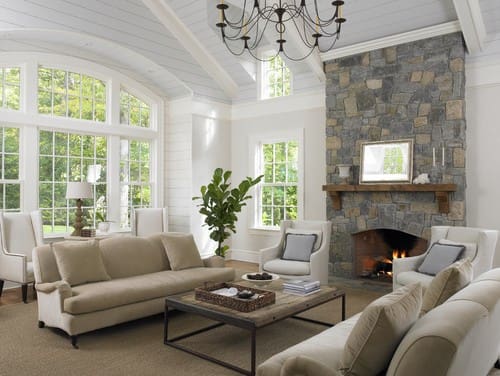 a living room filled with furniture and a fire place