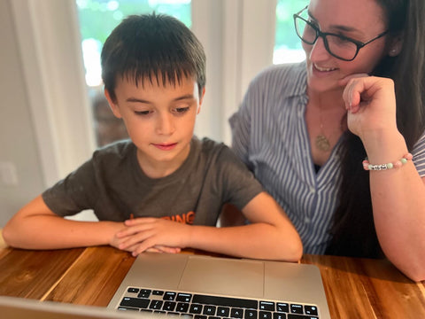 mother and son doing Lexercise online together