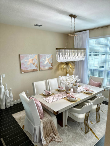 Varaluz Lafayette pendant over an ivory dining table in a glamorous dining room