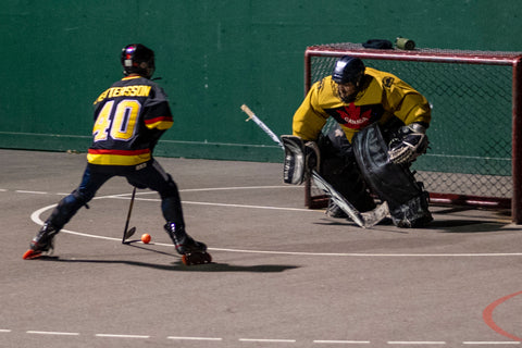 Photo from Tony Hockey of a breakaway in an outdoor roller hockey game at Inter River Park in North Vancouver.