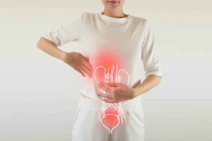 An illustration of the digestive system overlaid upon a woman's abdomen