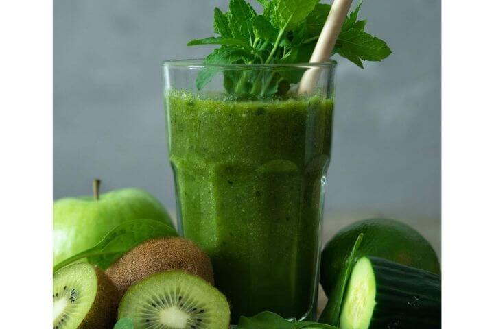 Green liver detox smoothie in a glass