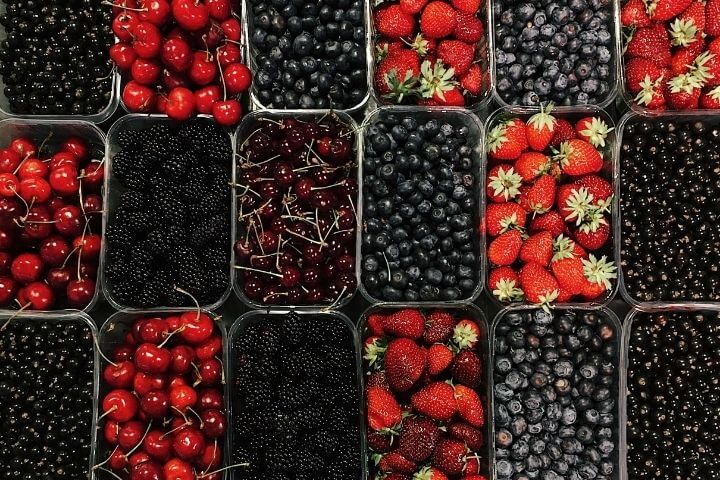 Red and Black berries on a black container