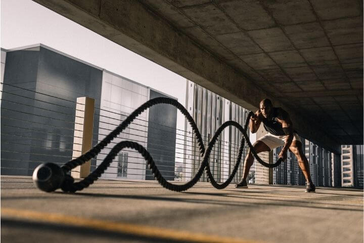 A man working out using rope technique