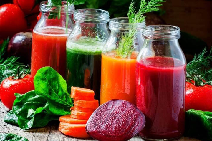 bottles of vegetable juices - lettuce, beetroot, caroot and tomato juice