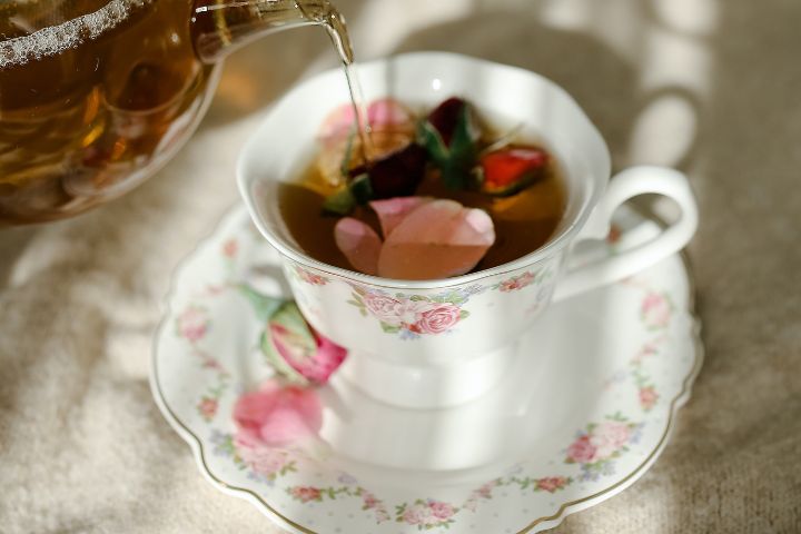 photograph-of-tea-being-poured-into-a-ceramic-cup