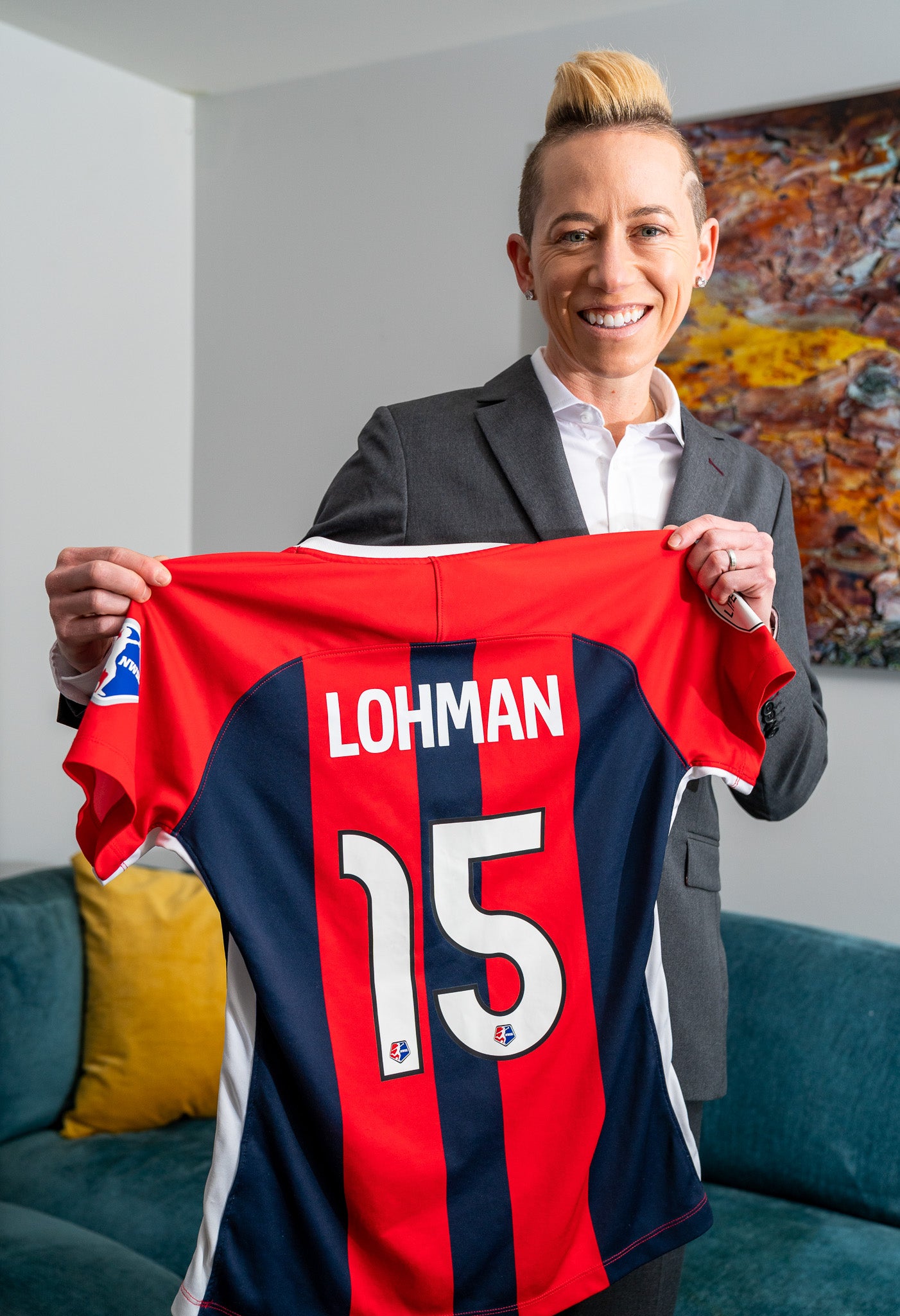 Jo Lohman Holding Up Soccer Jersey