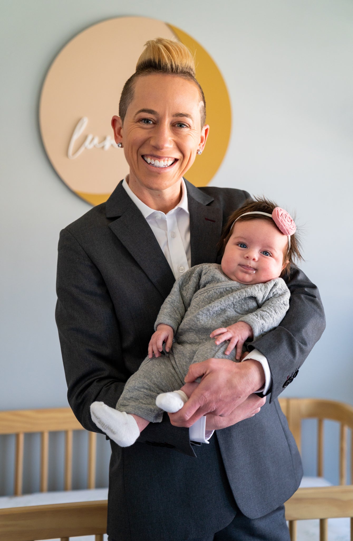 Jo Lohman holding their baby Luna