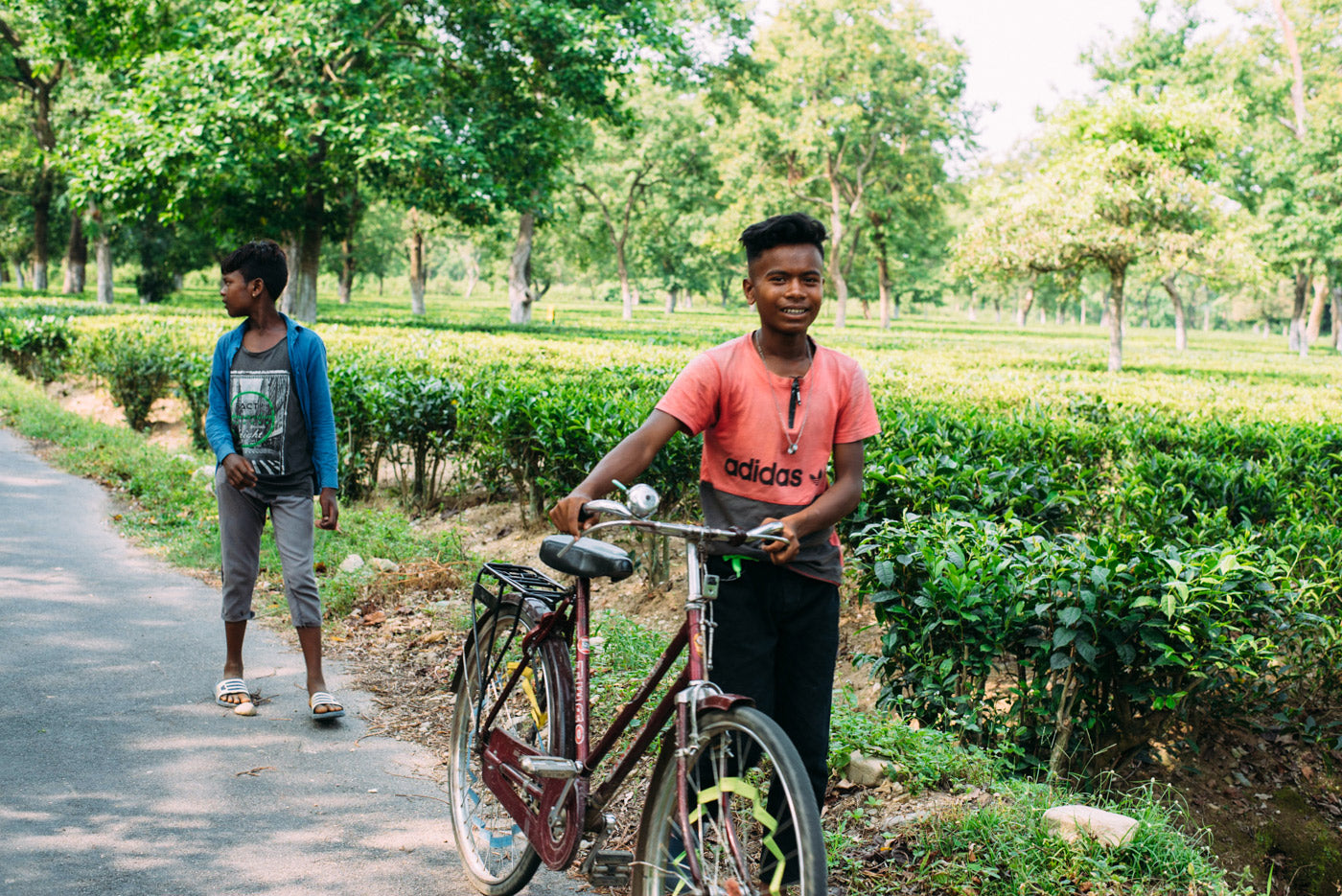 Boy on bike at tea estate single origin