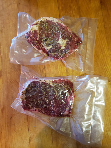Raw ribeye steaks with Montreal Seasoning vacuum packed