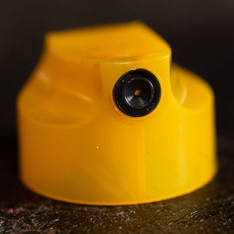 Universal thin spray cap. Yellow with black dot.
