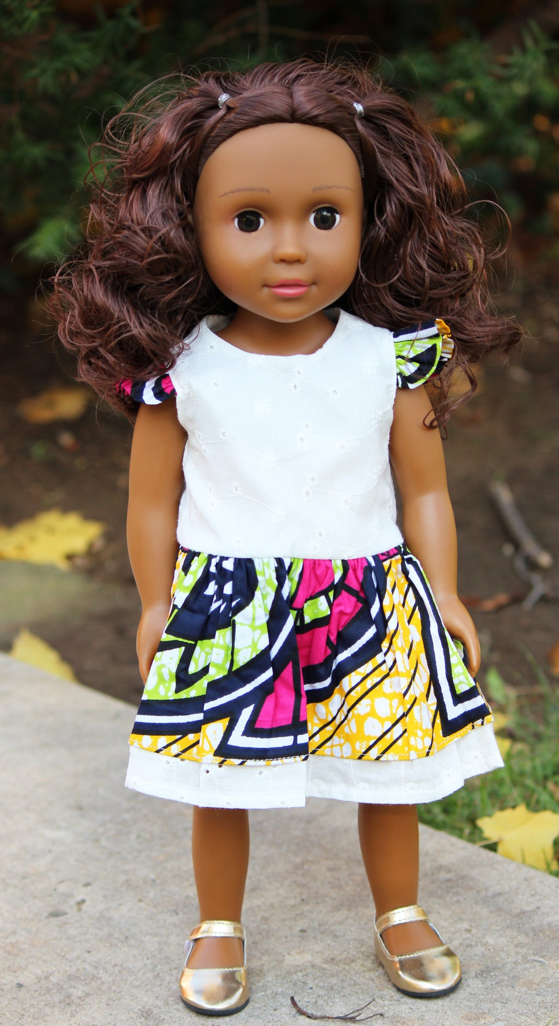 medium brown skin tone doll with wavy brown hair