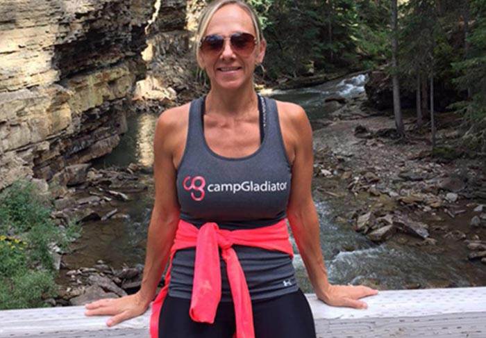 A photo of Missy Beavers in front of a waterfall