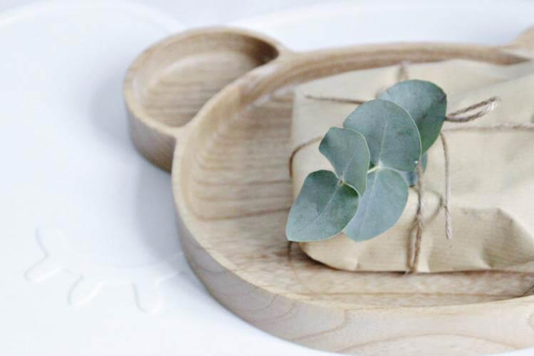 Eco packaging on wooden bear plate