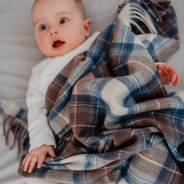 The tartan blanket co lambswool baby blanket in stewart muted blue tartan
