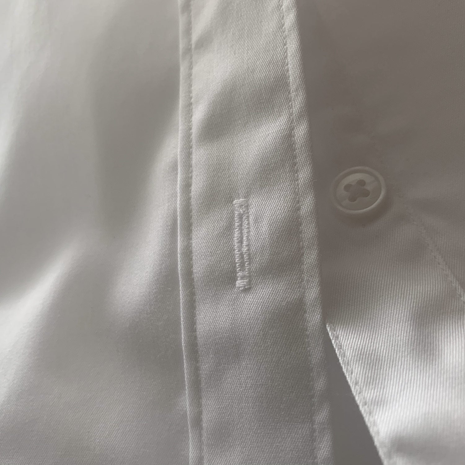 Clean finished button holes on mens shirts image