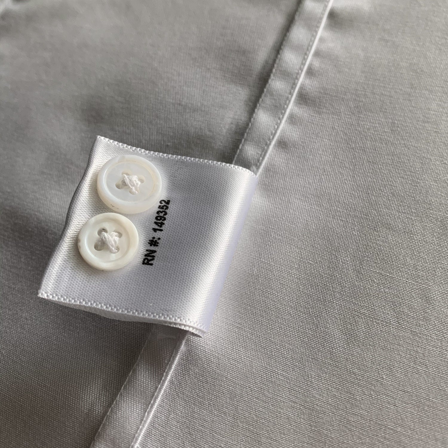 Spare buttons on high quality mens dress shirt