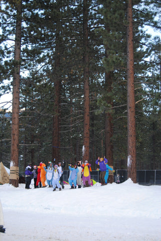 rave group matches in character onesies 
