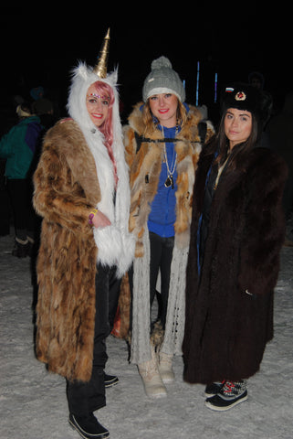 rave girls wearing large fur coats at snowglobe