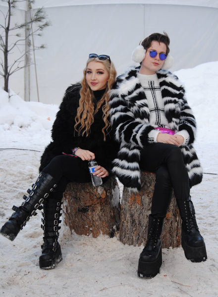 rave friends stay warm in fur coats at snowglobe