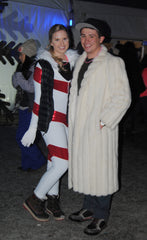 rave couple stay warm with big fur coat at snowglobe