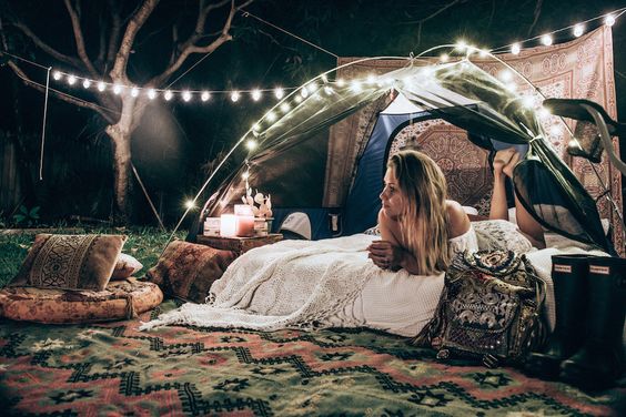 rave girl enjoying peaceful campsite setup