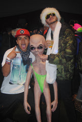 ravers posing with alien toy at snowglobe