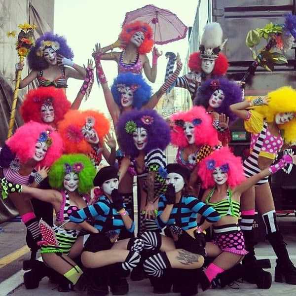 rave girls wearing colorful clown outfits 