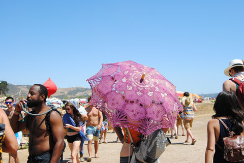 ravers who are prepared for the heat at lightning in a bottle festival