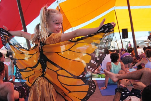 toddler enjoying lightning in a bottle wearing a butterfly costume