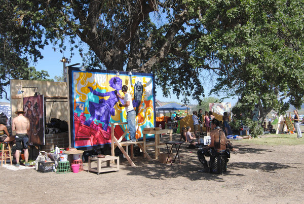 ravers enjoy painting at lightning in a bottle