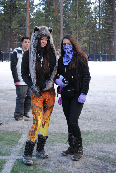 rave girls pose in the snow at snowglobe