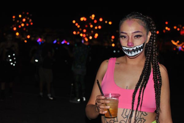 spooky rave girl wearing neon pink