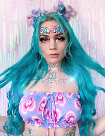 Raver with aqua hair and turquoise face jewels