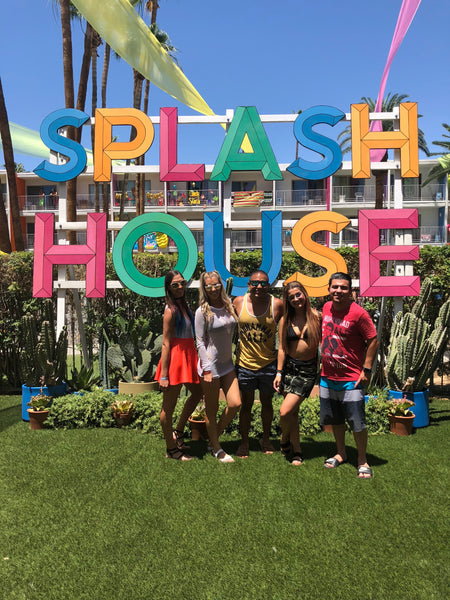 Squad hanging out in front of Splash House Sign 