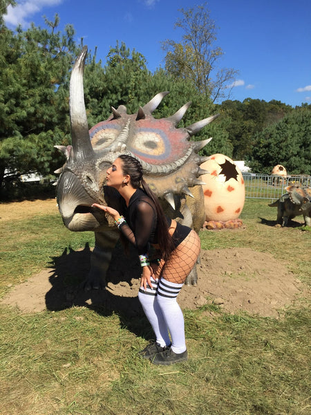  iHeart Raves rave girl in festival outfit at Lost Lands Festival 2017 with baby dinosaur